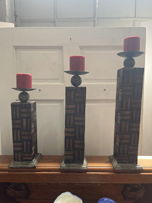 Three decorative candleholders